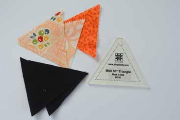 Join 9 orange + black triangle pairs into one long strip, adding the 10th black triangle to the final