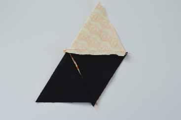 Sew the other rectangle of background fabric to the bottom edge of the triangle strip. Press.
