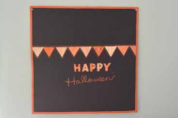 No need for perfect cutting. Place the HAPPY letters printed side down on various orange scraps and set the transfer ink using a hot iron. Use embroidery scissors to cut out the letters.