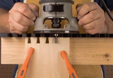 Place your router flat on top of the dovetail jig surface with the bit in between one of the openings. Be sure the cutter is not contacting the wood surface before turning your router on.