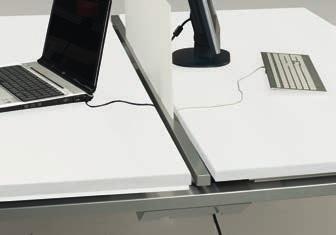 provide easy access to a central cable trough whilst limiting costs and preserving the design of the Bench desks ; The sliding mechanism facilitates access to cables and trailing sockets