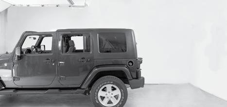 Position top above Jeep with clearance to open garage door.