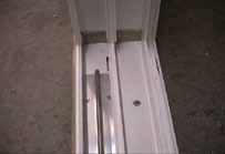 8 Install the aluminum jamb inserts in the exterior track of the side jambs on the