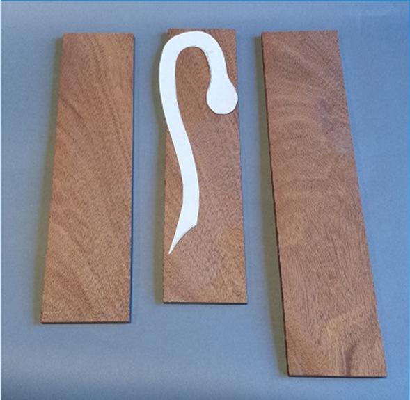 To make the snake handle, cut three pieces (or one longer piece) 3/16 inch thick by 2 1/2 inch wide and 8 inches long Draw a pattern to fit the wine pourer.