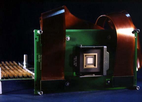 segmented device. Figure 2 is a photograph of the 1024 actuator device in a test fixture.