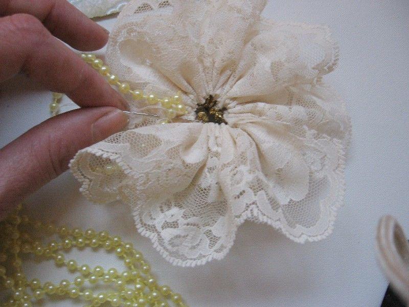 Attach a strand underneath each of the 3 larger flowers with
