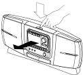 BATTERY COMPARTMENT COVER BATTERY COMPARTMENT COVER LATCHES BOTTOM OF BOOM BOX 1. Turn the Boom Box upside down to access the battery compartment. 2.