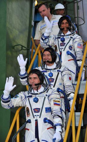 Photo 2. Expedition 32 crew members prepare to board the Soyuz launch vehicle.
