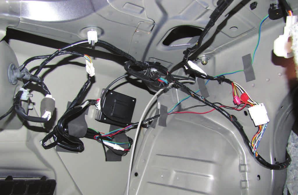 Cut the terminal off the black wire in Wire Harness #1 and use the wire clip to attach it to the black wire in the vehicle harness.