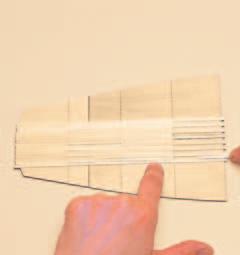 Attach two 10cm slats, making them align with the central reference line.