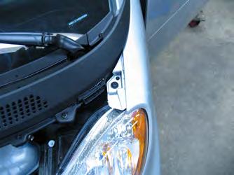 Using the 25 Torx, remove the bolt above the headlight.