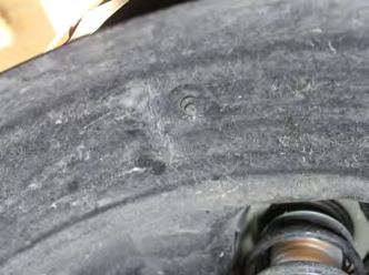 15. Remove push pin from the top of the wheel well. Do this on both sides.
