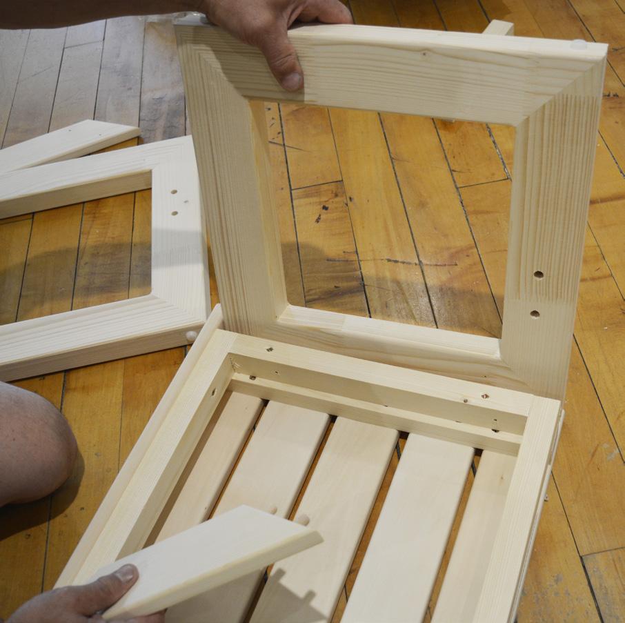 STEP 28 - Assemble the lower bench by attaching the right and left framed leg supports to