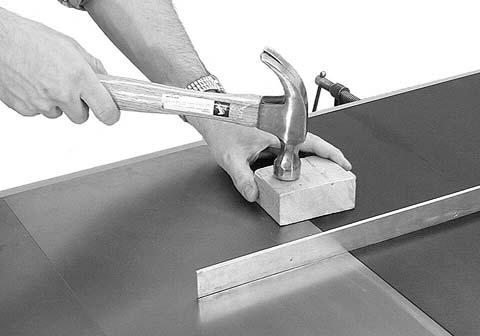 5. Lay a straight edge across both extension table and saw table to ensure proper leveling.