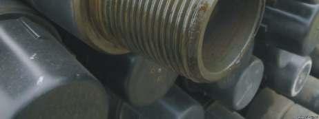 helical thread line with a minimal clearance between the bottom of the thread and EC probe operational surface.