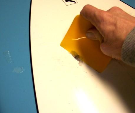 Wax Removal: Remove surf wax with wax remover or other means. Letting the wax warm up in the sun or a warm car and then scraping it off with a plastic squeegee works well.