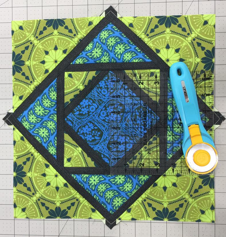 Repeat with the remaining 3 triangles of fabric C with the other edges of the in-progress block. Pin in place. 16.