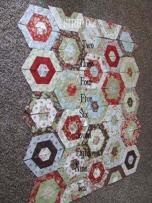 Step Six - Sew your half hexagons together (pinning at the seams) to make a row like pictured below.