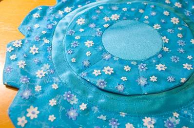 Place right sides together and stitch the outside of the large circle to form the petal edges.