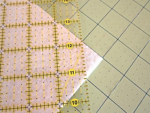 2. Trim the corners from one 8" side (this will become the top of the wallet). To create the proper angle, measure 1" in from the corner and mark, then measure and 1" down from the corner and mark.