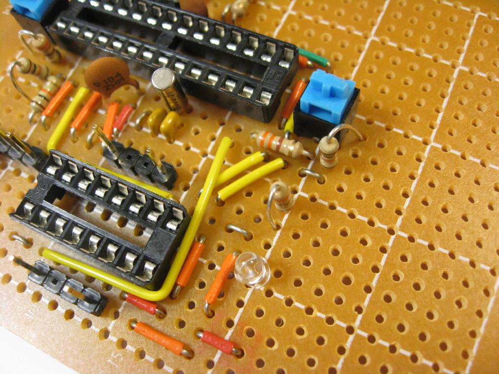 Place (2) 330 Ω resistors, (1) 10 kω resistors, and an LED as