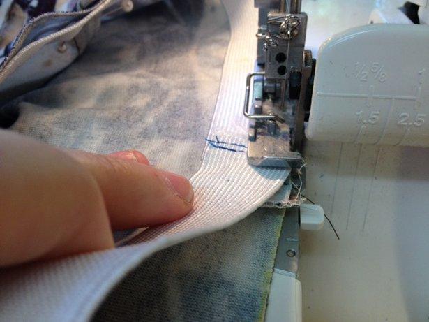 Step 5 Overlock elastic top edge to waist edge Next, *overlock the top elastic edge to the raw waist edge on pant, stretching the elastic between the 4 quarters to fit onto the waist edge, this will