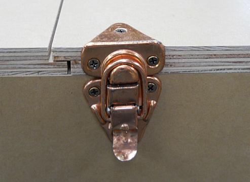Cut the doors to height and add 3/8 to the width of one door if you want them to overlap, as shown. By doing so, only one latch is required. Cut the rabbet and secure one door with two hinges.