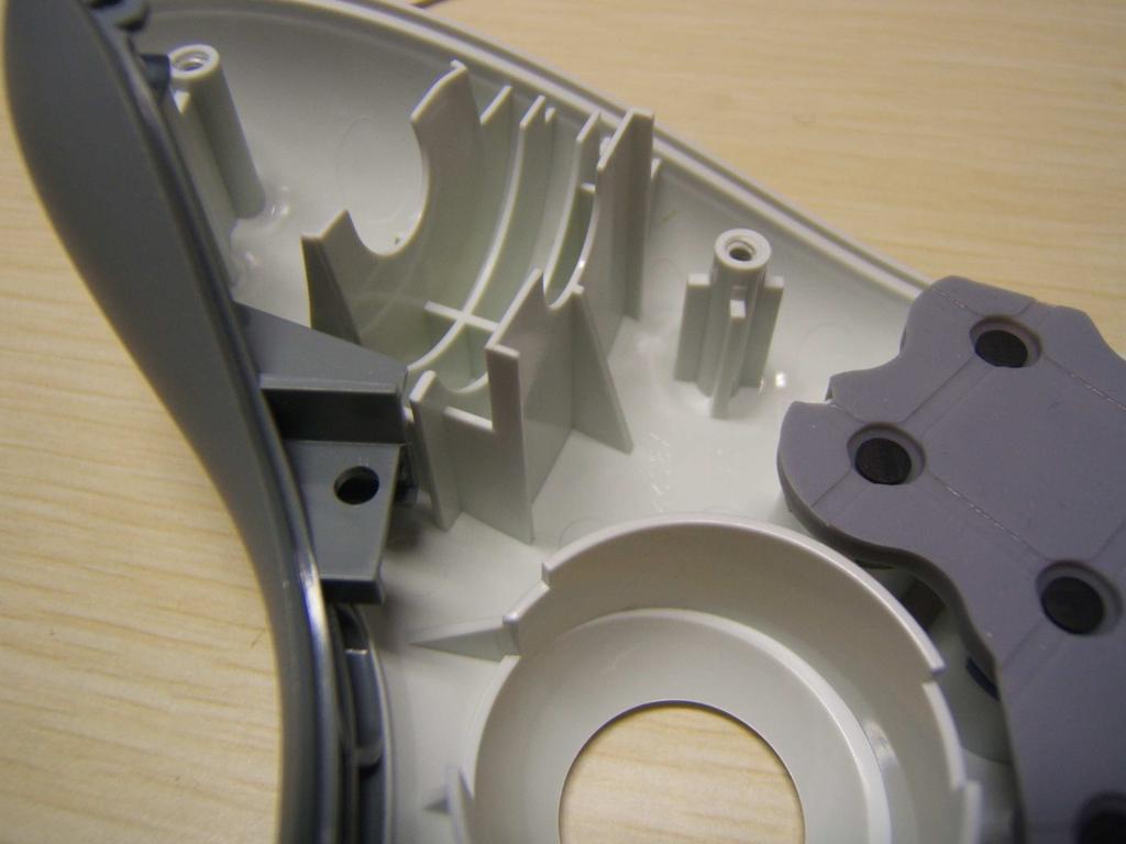 Depending on your button placement you may also need to remove part of the back support for the rumble motor. This is shown in green in the images.