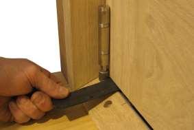 of the door and the Bottom Swivel. Lift Door Into Position and Screw In Top Swivel 3. Fitting the Handle Hinge Set 3.