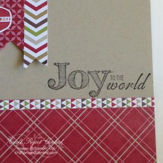 Adhere on the top edge of the red plaid DSP. Stamp the Joy to the World stamp from the Joy to the World stamp set on the right side of the Crumb Cake card stock base right above the ¼ strip of DSP.