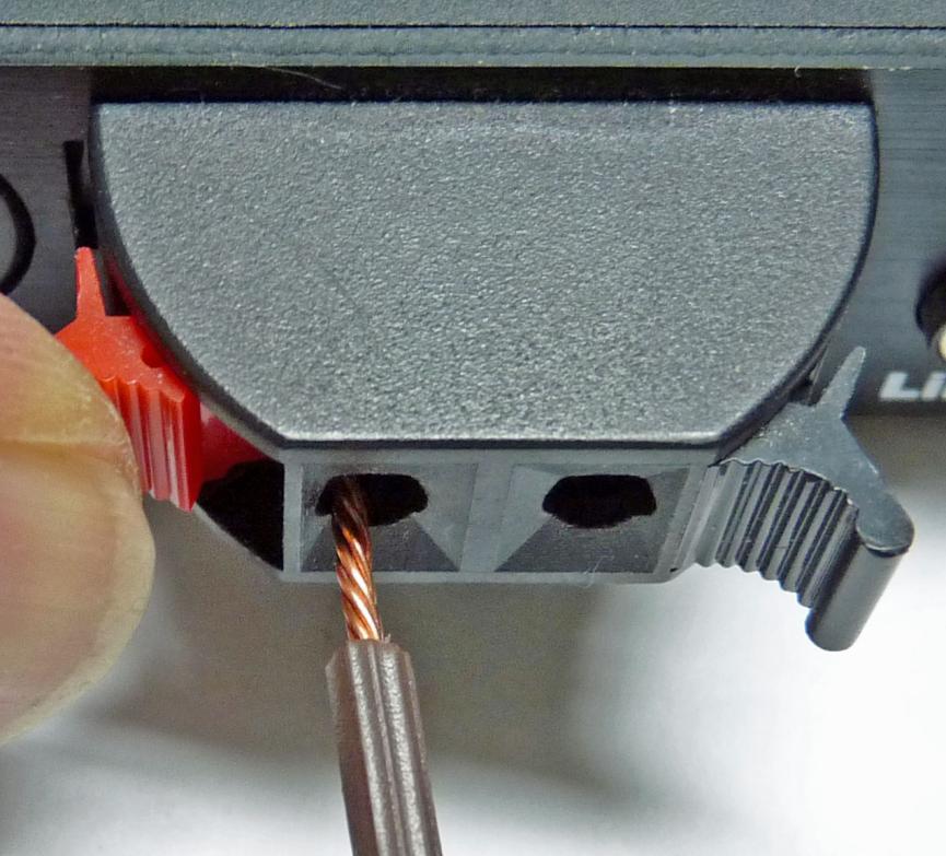 Insert the loop wire in the Univox DLS-50 Strip the insulation from the end of the loop wire,
