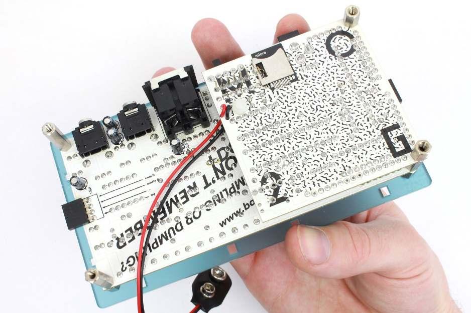 Take the panel with one of your hand and place the paired PCBs with the other hand on.