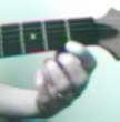 Pick form your wrist and lightly touch the palm of your right hand near your thumb lightly on the lower strings (5th and 6th).