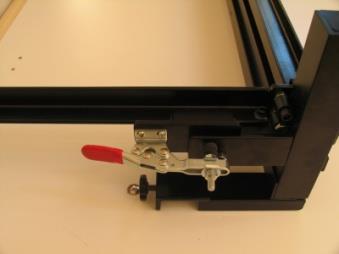 of the side rail. If more or less pressure is required, adjust the toggle clamp height adjust bolts.