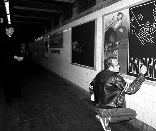 One day, while riding the subway, Keith noticed the plain black paper hanging in all the unused