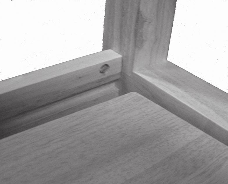 3. Once both Legs have been fastened to the Cross Brace, slide the Shelf (2) above against the Legs so that the far edge fits onto the groove on the Cross Brace. See Figure C, right.