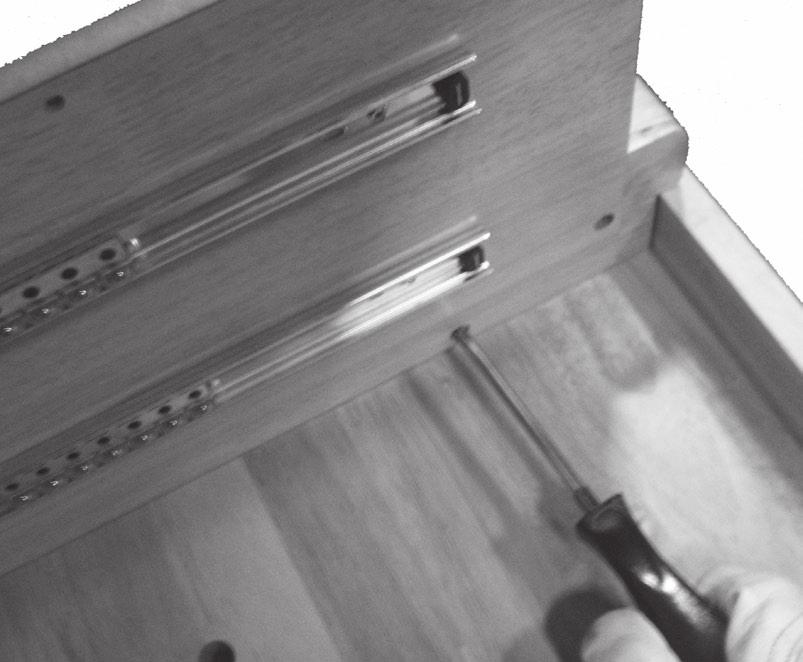Use the Hex Wrench and Screws (13) to fasten the sides of the Legs to the Table Top underside. See Figure J, right.