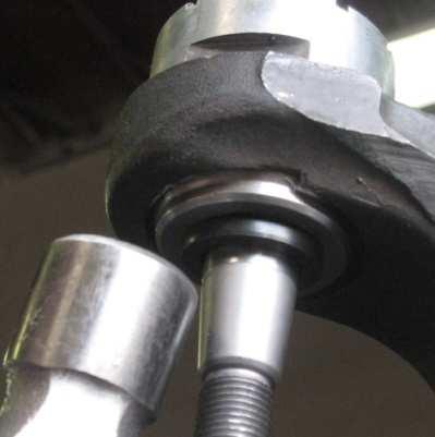 Hammer directly on the installation bushing until the ball joint socket is fully seated