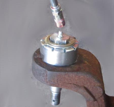 A 7/8 socket and a 15/16 socket are required to tighten the ball joint nuts.