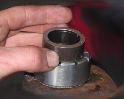 Hammer directly on the installation bushing until the ball joint socket is fully seated against the