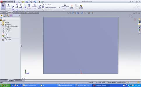 . SELECT THE EXTRUDED CUT TOOL then select the face of the block shown on screen as indicated.