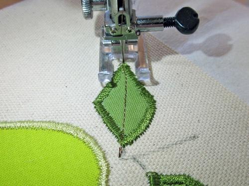 21. Stitch across one leaf to its tip; with the needle down, pivot and stitch back over this first line with a second line for a nice,