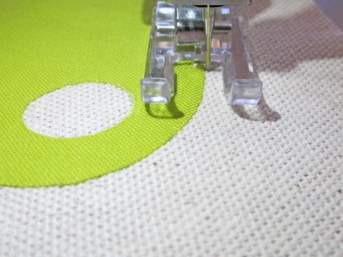 15. Stitch around the appliqué, pivoting as needed (with the needle down and the swing to the right - into the base fabric).