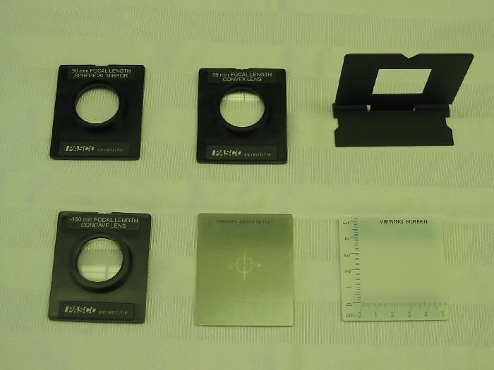 Figure 10.3: The left photo shows the lenses, viewing screen, cross arrow target and a component holder. The right photo shows the light source, lenses and viewing screens on the rail. Figure 10.