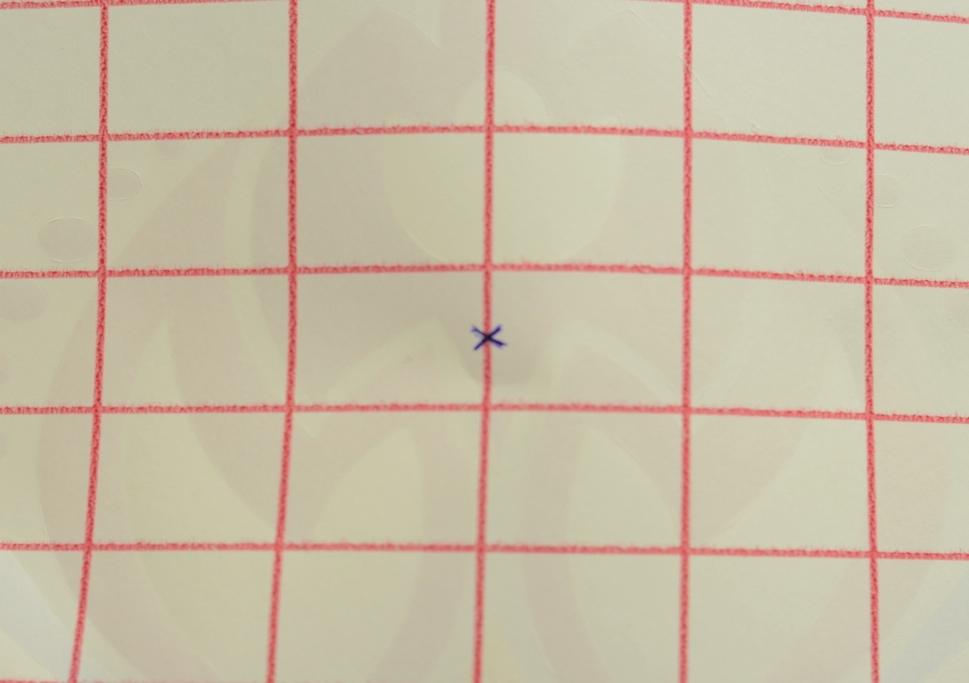 Find the center of the grid on the back of the transfer.