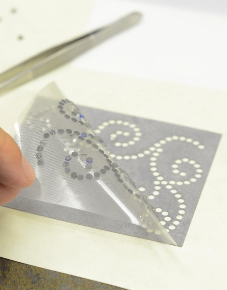 RHINESTONE TEMPLATE After the tape is down, apply pressure onto the stones to ensure that the tape will hold the