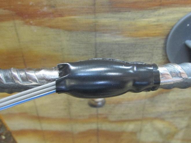 Only the insulated portion of wire should be visible after this step (Figure 14).