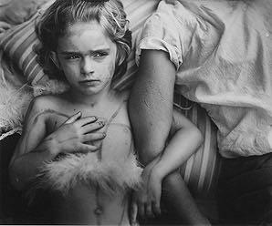 Sally Mann, Jessie Bites Rule of Thirds The Rule of Thirds is a compositional guideline that divides an image both vertically and horizontally into thirds.