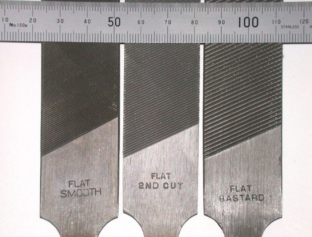 4 is used to clean built up metal from the file. Flat files can be used to deburr straight edges, half-round files are suitable for curved edges or large holes and round files can be used on holes.
