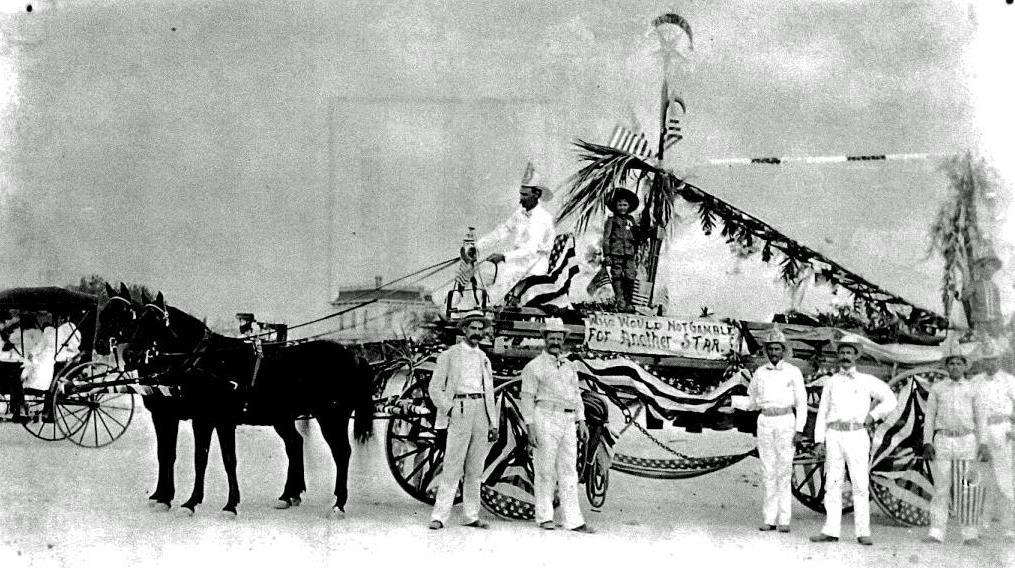A TFD float in the 1898 4 th of July Parade. Three future TFD Chiefs are shown. Harry Parker is in the driver s seat. Frank Russell is standing, second from left; George Smith is fourth from left.